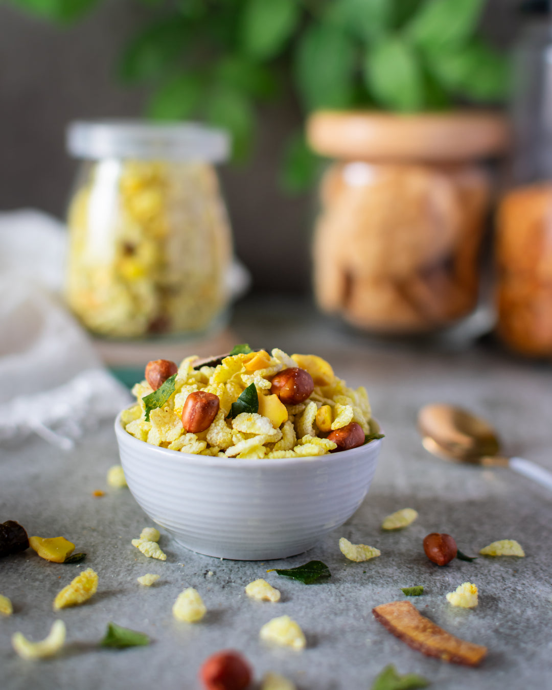 Chivda placed in a small white bowl 