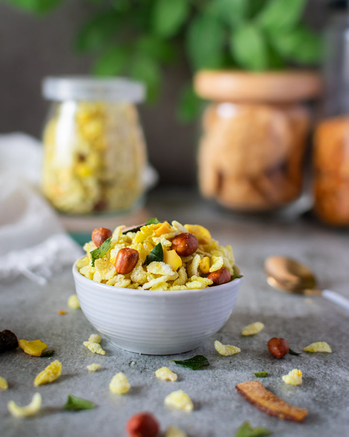 Chivda placed in a small white bowl 